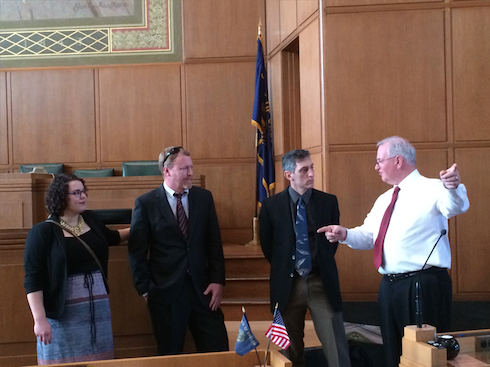 Volunteers Sage DeLuna, Leo Newberg and Vince Pappalardo get a tour of the House floor with Rep. Gomberg